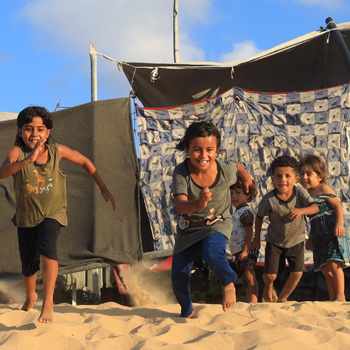 Children running on the beach